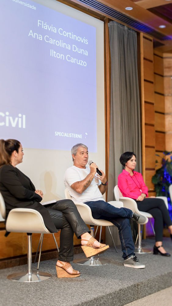 Photo of man speaking on a stage